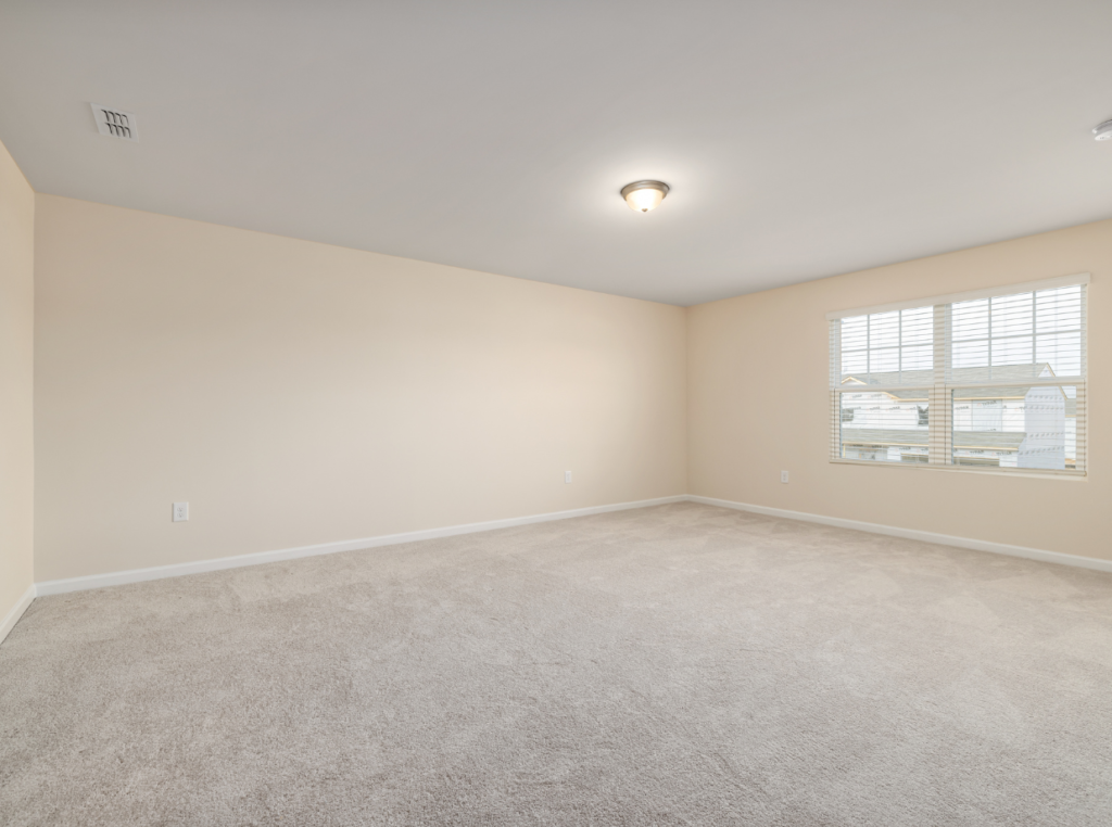 a room with beige carpet